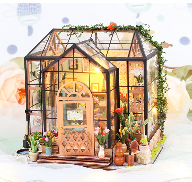 Jenny's Greenhouse DIY dollhouse kit featuring a detailed 3D wooden puzzle with plants and warm lighting.