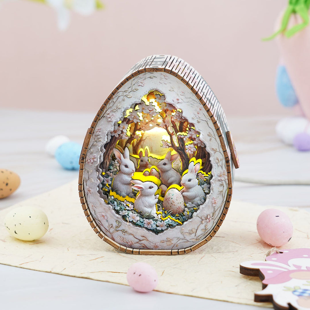 Easter Egg Secret Realm Kit 3D wooden puzzle night light featuring bunnies and eggs, illuminated with a soft glow.