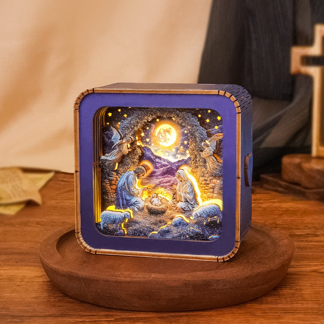 3D wooden puzzle night light featuring a nativity scene with Mary, Joseph, baby Jesus, and angels.