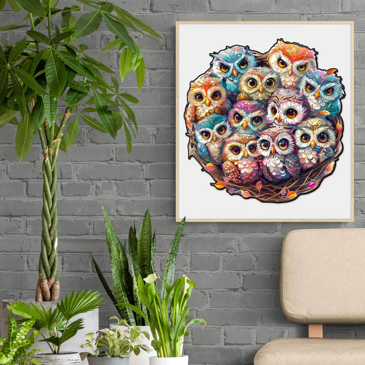 Colorful baby owls illustration in a nest, perfect for nursery decor and jigsaw puzzle lovers.