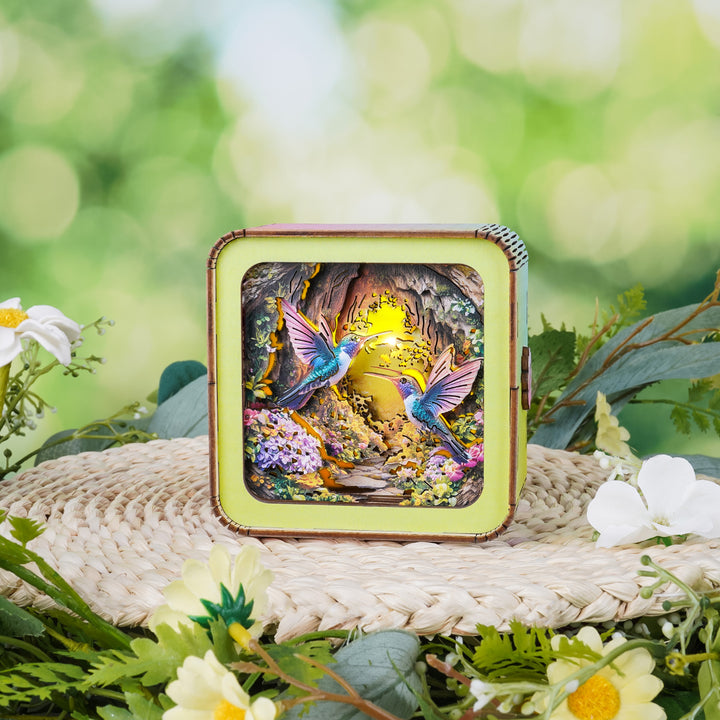 Colorful 3D wooden puzzle night light featuring hummingbirds in a vibrant floral setting.