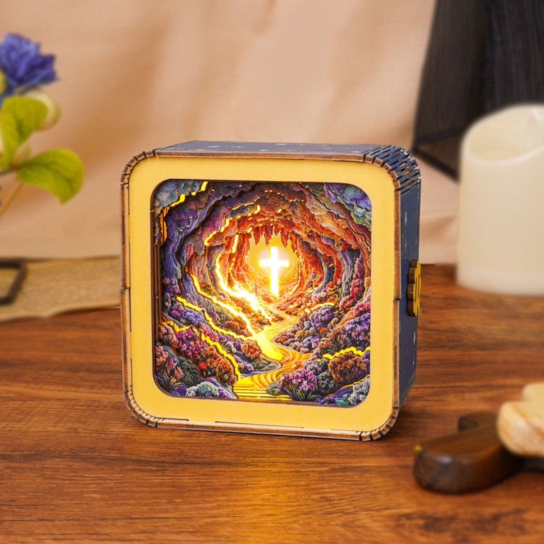 3D wooden puzzle night light featuring a luminous cross in a colorful cave setting, perfect for home decor.