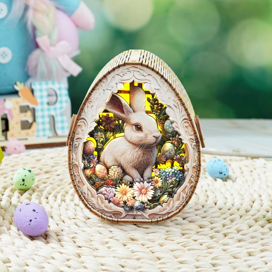 Easter Egg Messenger Kit featuring a 3D wooden rabbit night light surrounded by flowers and colorful eggs.