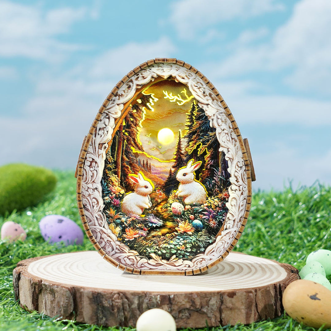 3D wooden puzzle night light featuring rabbits in a forest, illuminated by a glowing sunset, on a wooden base.