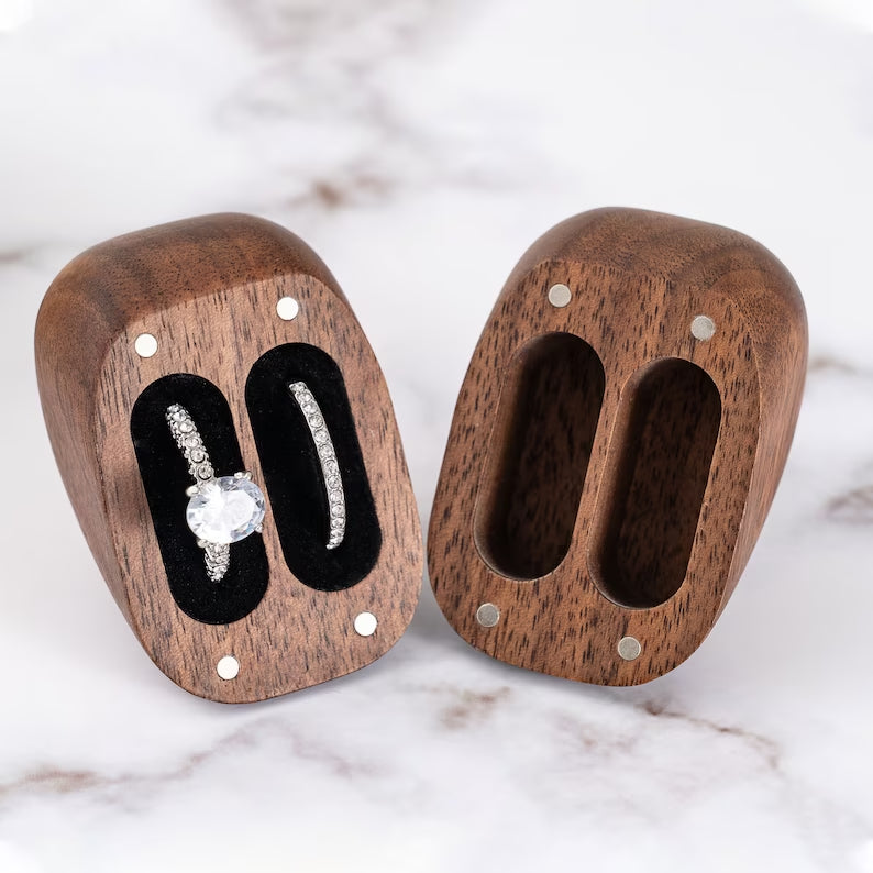 Custom walnut heart-shaped ring box with double slots for couples' rings, perfect for proposals and anniversaries.