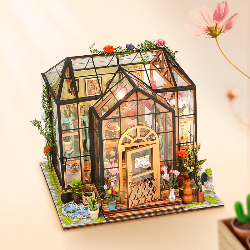 Jenny's Greenhouse DIY dollhouse kit displayed as a detailed 3D wooden puzzle with vibrant flowers and intricate design.