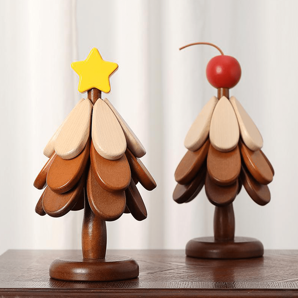 Two wooden Christmas tree decorations with natural textures and colorful star and cherry ornaments.