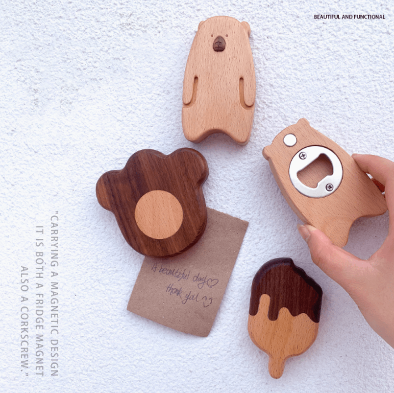 Multi-shaped wooden bottle openers with magnets, featuring bear, paw, and ice cream designs on a white background.