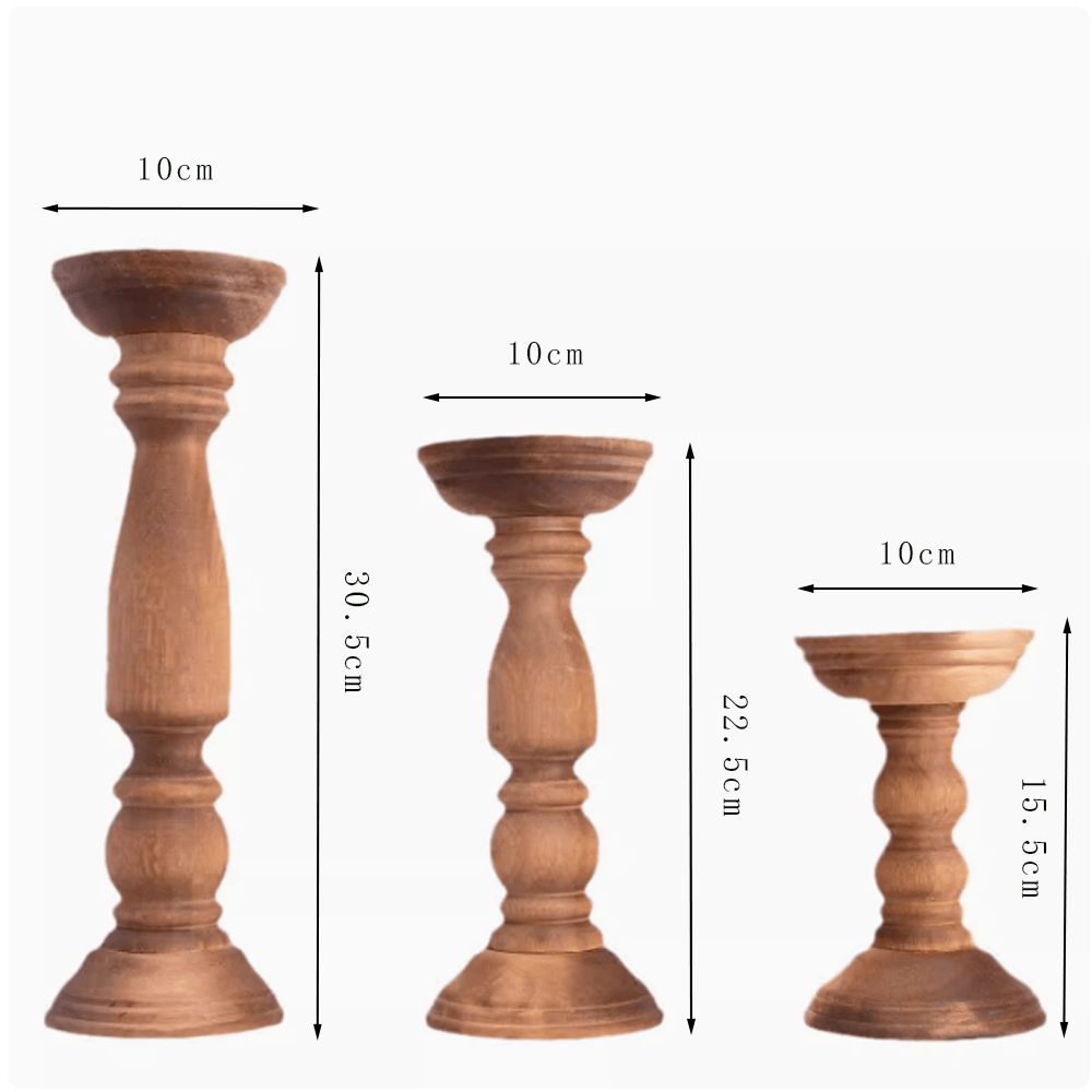 Three vintage Paulownia wood candle holders in varying heights, showcasing wabi-sabi design with rustic texture.