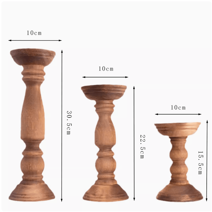 Three vintage Paulownia wood candle holders in varying heights, showcasing wabi-sabi design with rustic texture.