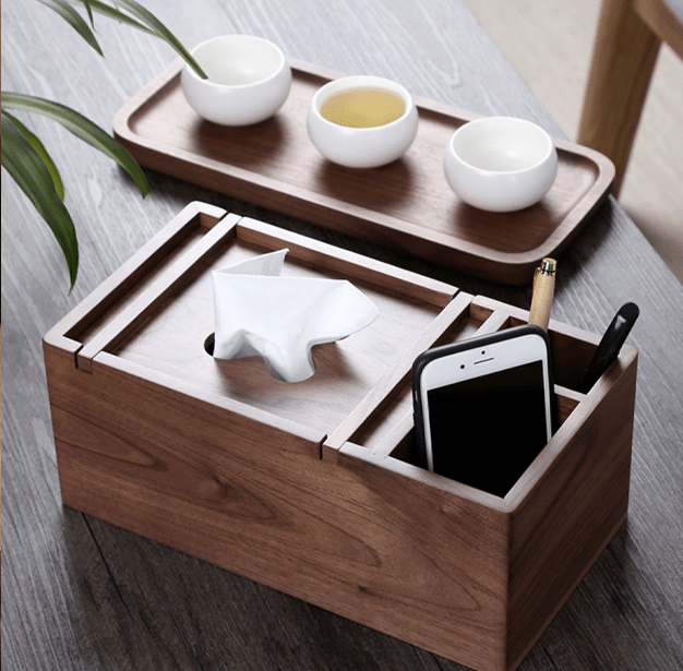 Wooden multifunctional tissue box with storage compartment for phone and accessories, made of natural black walnut.