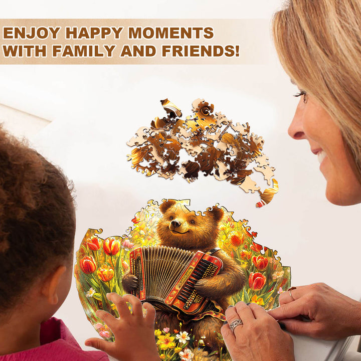 Woman and child assembling a Melody Meadow wooden jigsaw puzzle featuring a bear playing accordion among flowers.