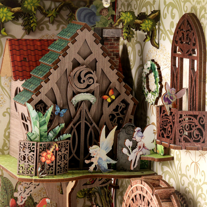 3D wooden book nook kit featuring a fairy house with butterflies and detailed decorations.
