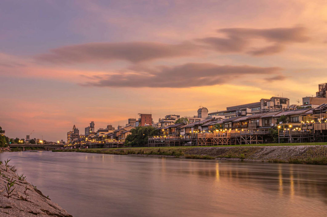 Scenic view of Sunset River City during twilight, showcasing tranquil water and charming riverside architecture.