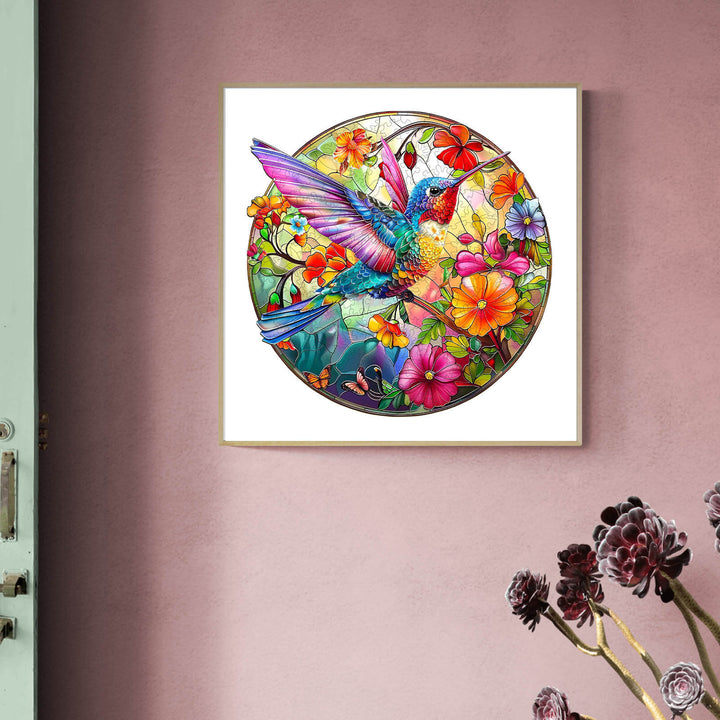 Stained glass hummingbird artwork surrounded by colorful flowers, perfect for home decor and jigsaw puzzle enthusiasts.