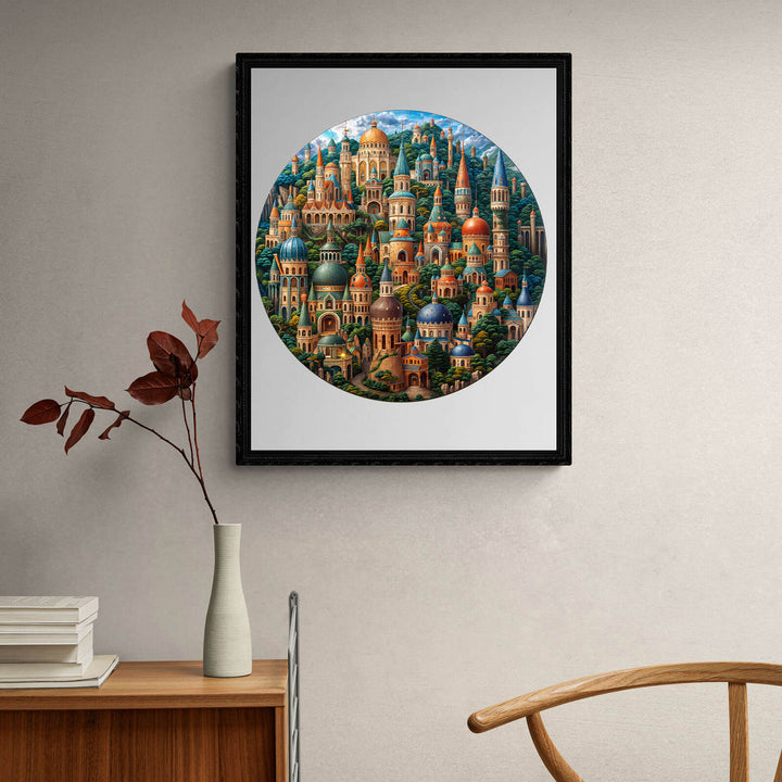 Colorful circular artwork featuring intricate buildings, framed and displayed on a minimalist wall.