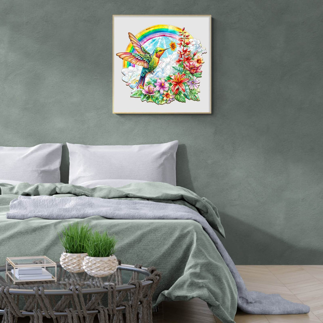 A colorful angel hummingbird artwork featuring flowers and a rainbow, enhancing a serene bedroom decor.