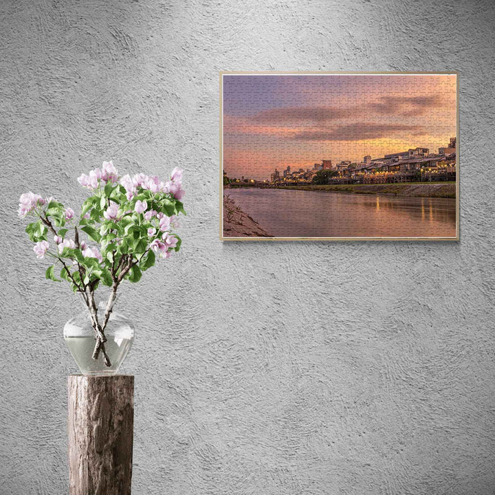 Sunset River City jigsaw puzzle displayed in a modern setting with flower vase, enhancing focus and mental skills.