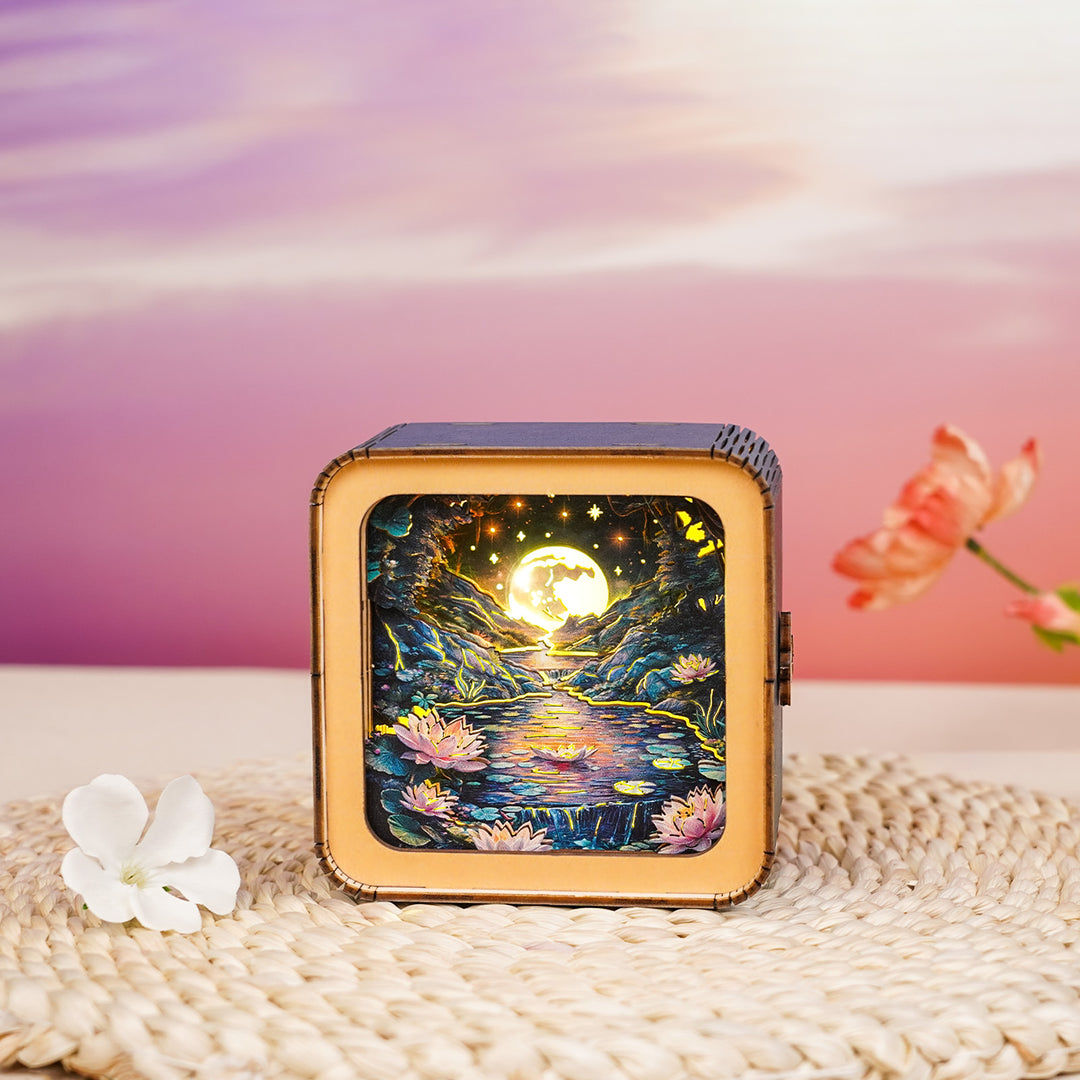 3D wooden puzzle night light showcasing a serene lotus pond scene under a glowing moon.