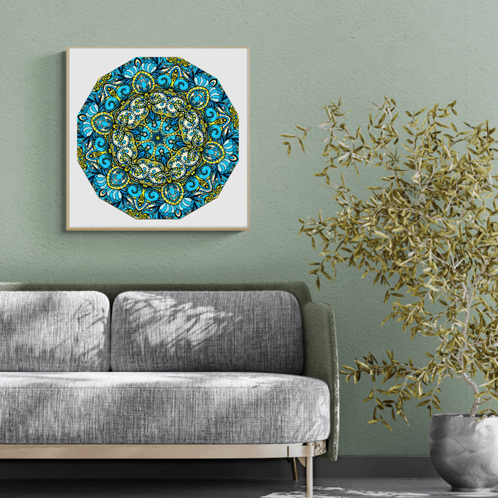 Colorful mandala art piece by Lori Anne McKague displayed on a green wall above a modern gray sofa.