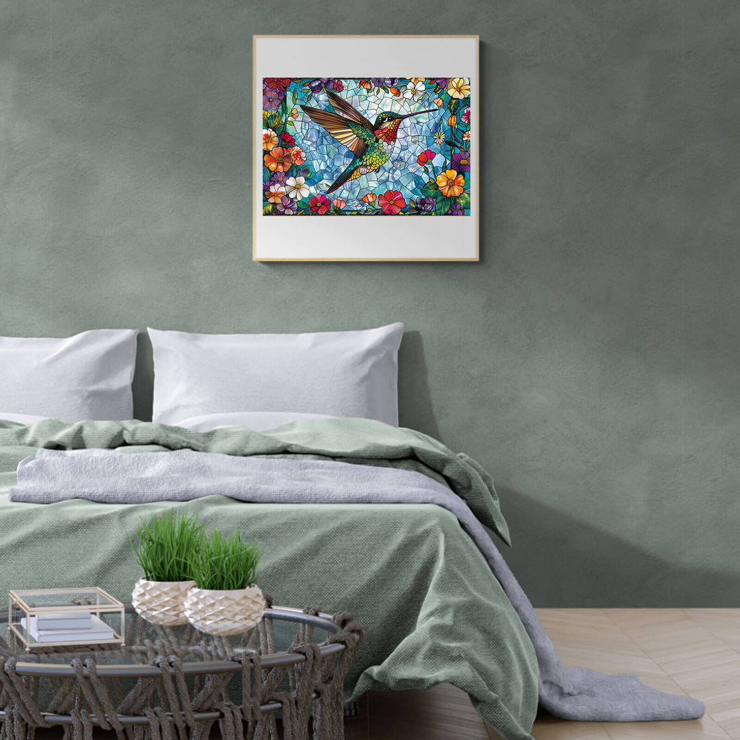 Stained glass hummingbird art print above a cozy bed, adding a colorful touch to bedroom decor.