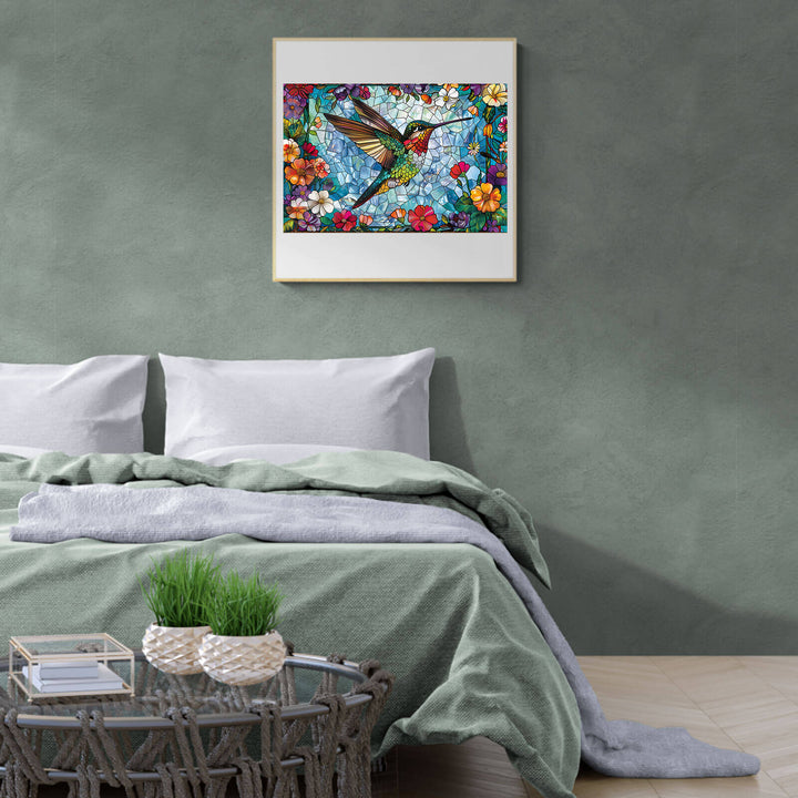 Stained glass hummingbird art print above a cozy bed, adding a colorful touch to bedroom decor.