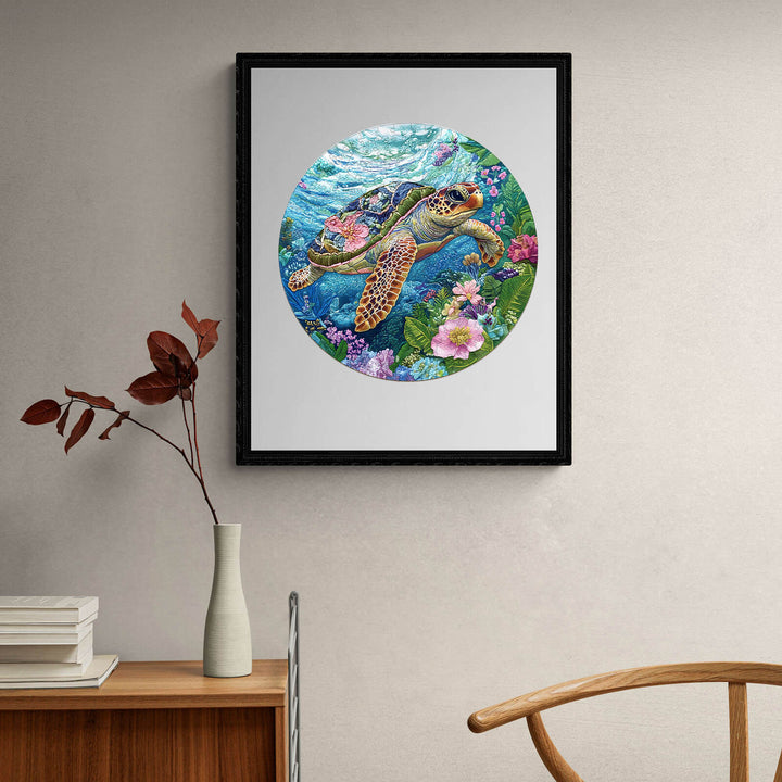 Embroidered turtle jigsaw puzzle artwork with colorful ocean backdrop and floral accents.
