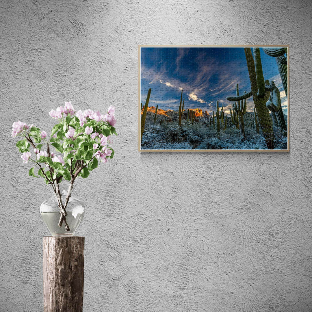 Beautiful snowy desert landscape puzzle displayed above a flower vase, designed for jigsaw puzzle lovers.