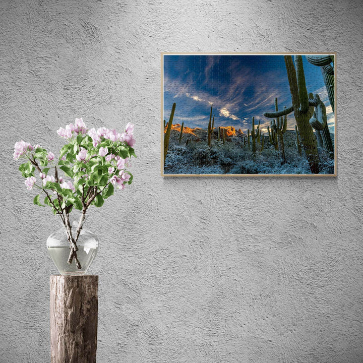Beautiful snowy desert landscape puzzle displayed above a flower vase, designed for jigsaw puzzle lovers.
