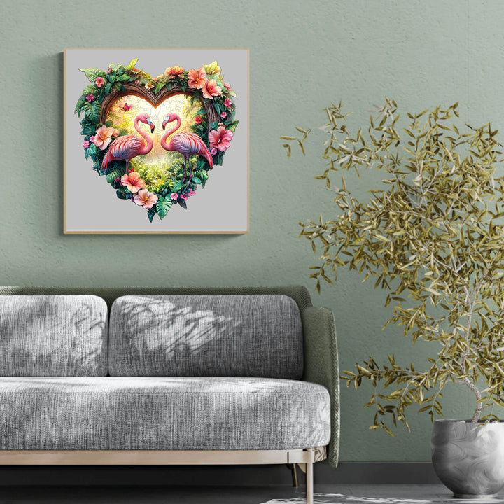 Colorful Love Flamingos artwork in a heart-shaped frame, decorated with lush greenery and flowers, enhancing home decor.