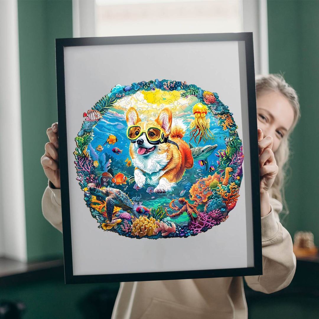 Colorful Diving Corgi wooden jigsaw puzzle artwork held by a smiling person in a bright room.
