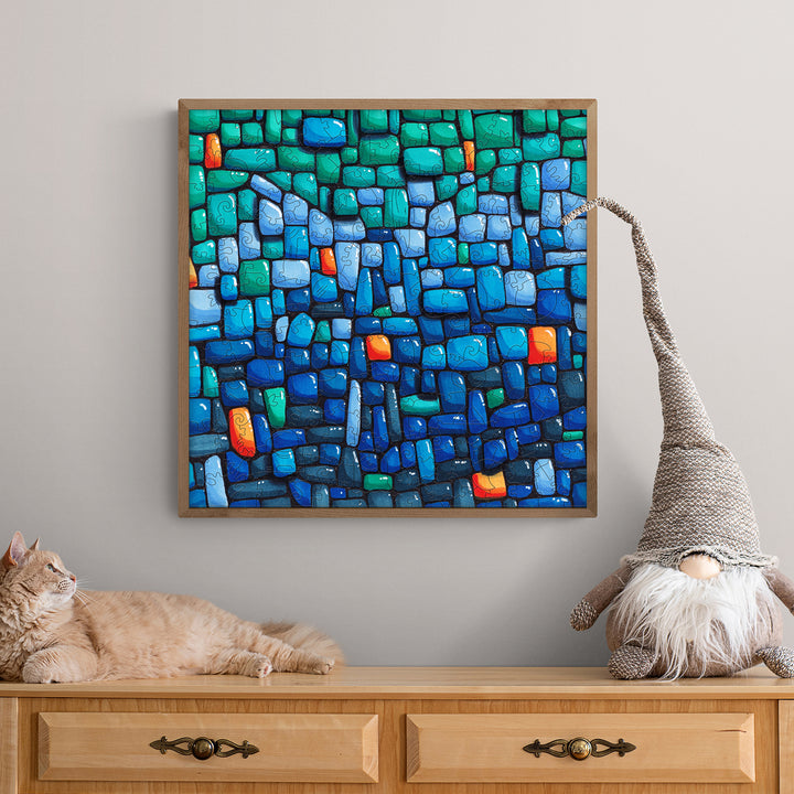 Blue Wall artwork by Erin Desjardine, featuring vibrant blues and greens, displayed on a stylish wood dresser.