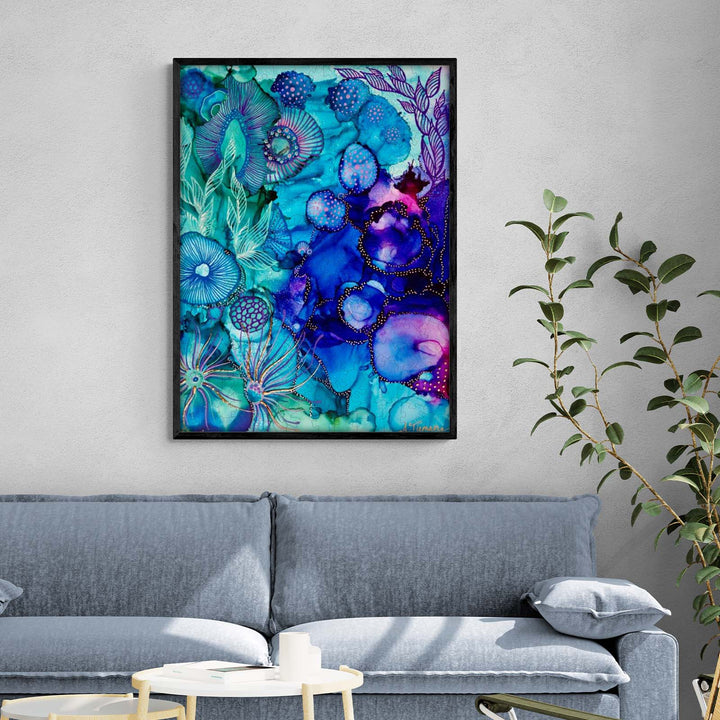 Art print 'Into the Mystic' by Amy Tieman, featuring vibrant blue floral designs, displayed in a modern living room.