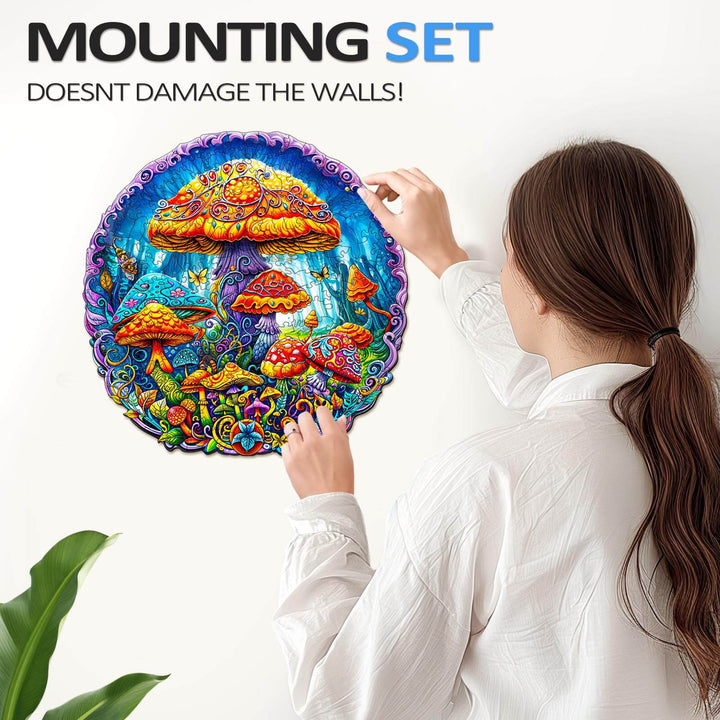 A person mounting a colorful Magical Mushrooms jigsaw puzzle on a wall with a mounting set that doesn’t damage surfaces.