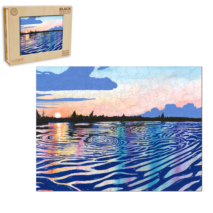 Black Rapids View puzzle by Sarah Bradfield showing a vibrant sunset over rippling water.