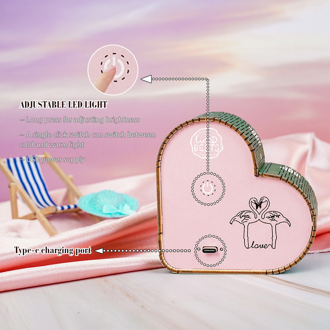 Close-up of heart-shaped adjustable LED light with Type-C charging port and brightness control features.