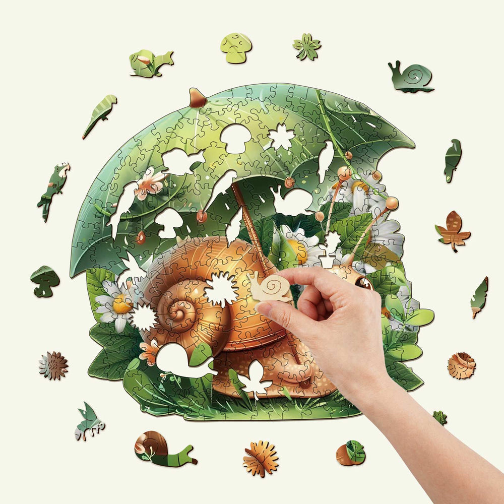 Hand assembling Leisurely Snail wooden jigsaw puzzle with vibrant nature scene and whimsical pieces.