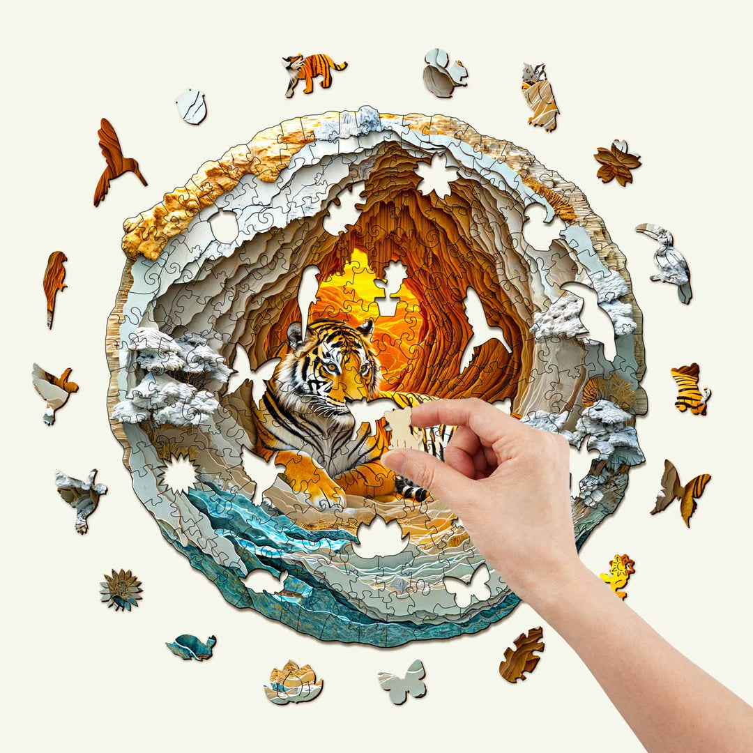 A hand assembling a 3D Tiger wooden jigsaw puzzle, featuring a tiger in a vibrant cave setting.