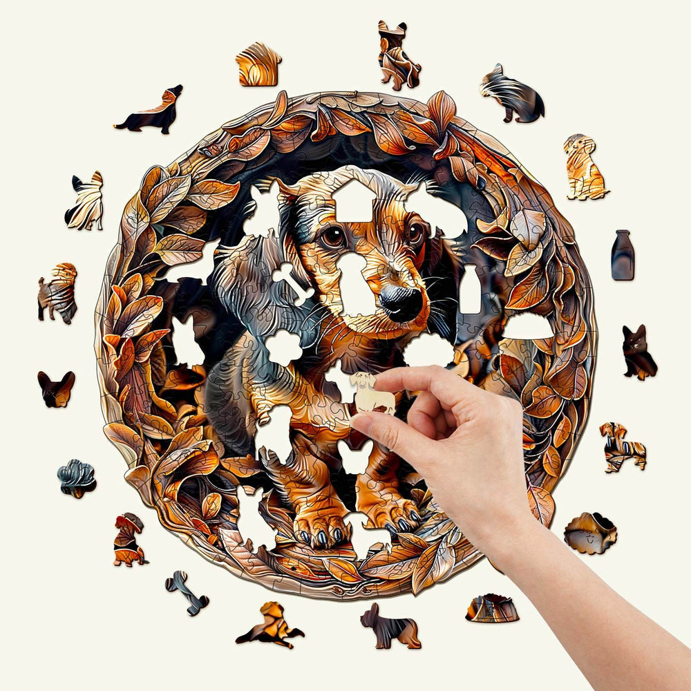 Hand placing a piece in a 3D Dachshund-2 wooden jigsaw puzzle, showcasing intricate dog and leaf designs.