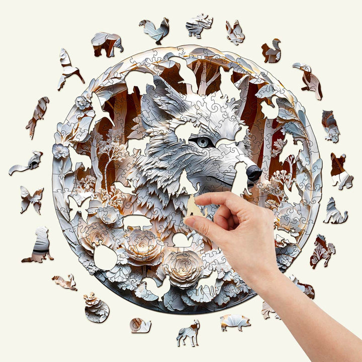 Hand holding a piece of 3D Wolf-1 Wooden Jigsaw Puzzle with wolf and forest themed pieces.