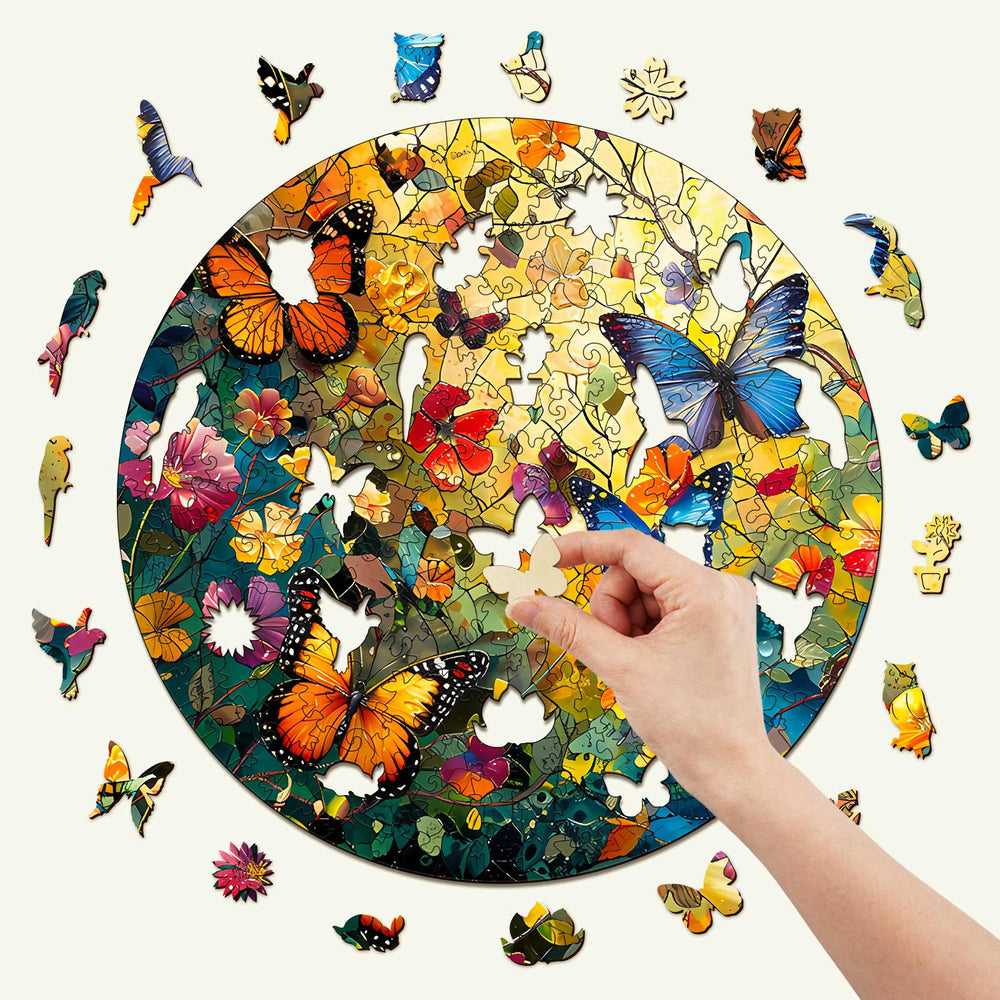 Hand completing a Butterflies and Flowers wooden jigsaw puzzle with colorful pieces surrounded by a circular design.