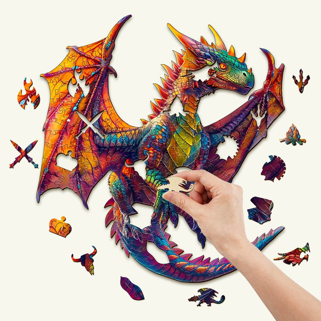 Person assembling a colorful dragon wooden jigsaw puzzle, promoting focus and mental agility through puzzle solving.