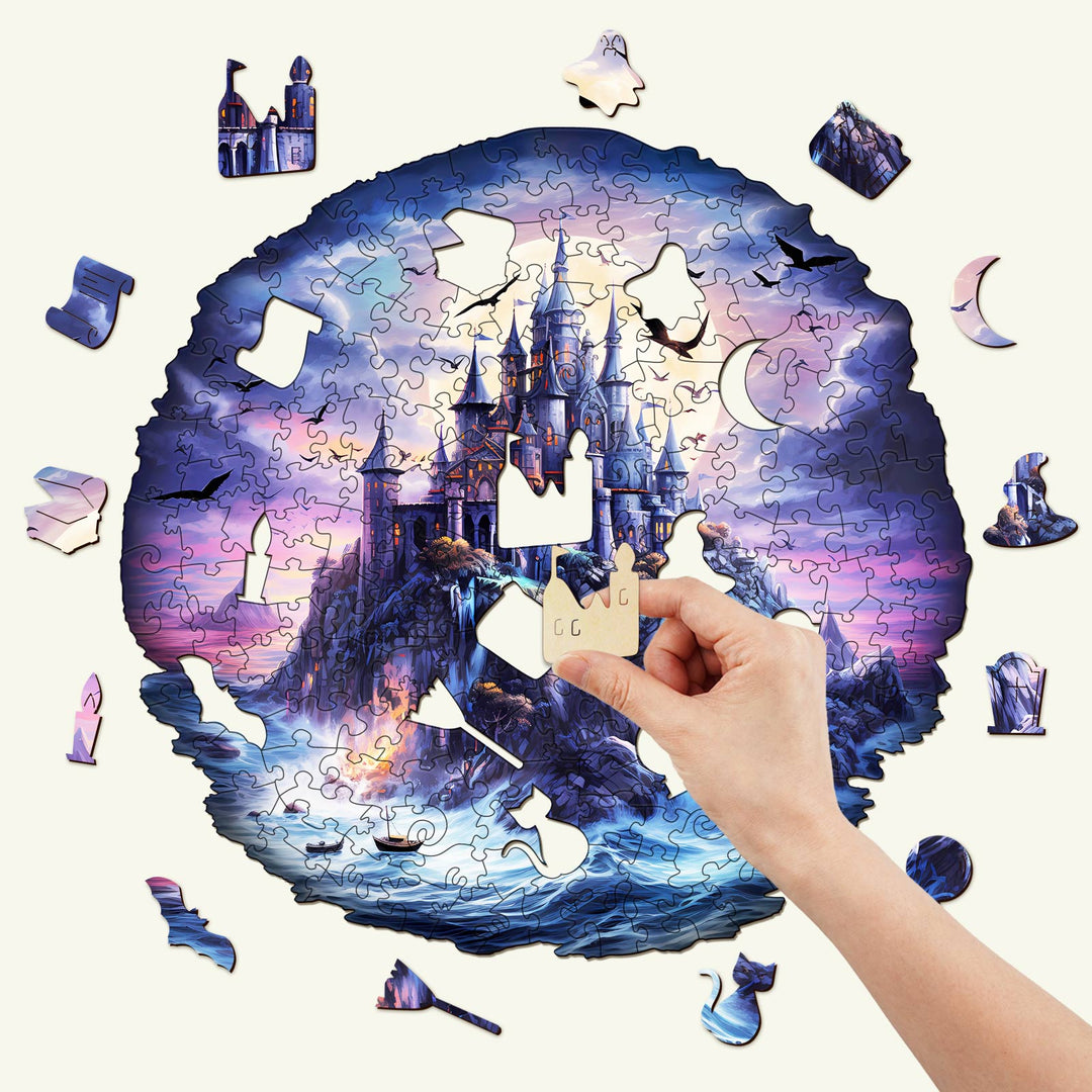 Hand placing a piece in the Mysterious Castle Wooden Jigsaw Puzzle, showcasing its beautiful design and intricate pieces.