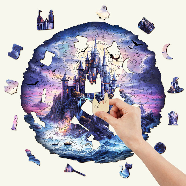 Hand placing a piece in the Mysterious Castle Wooden Jigsaw Puzzle, showcasing its beautiful design and intricate pieces.