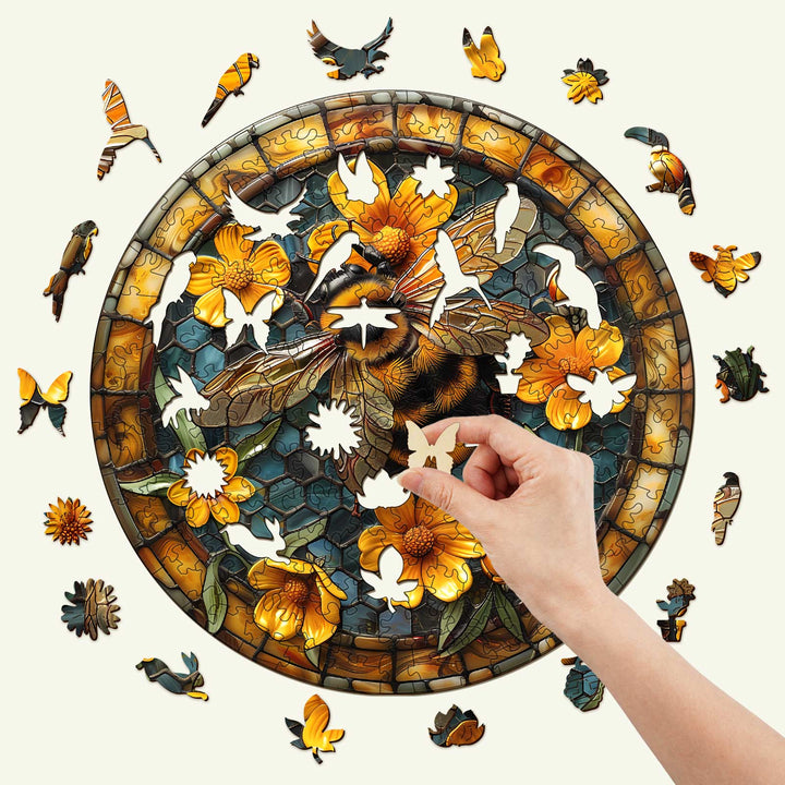 Leisurely Bee wooden jigsaw puzzle featuring colorful bees and flowers, showcasing a hand placing a puzzle piece.