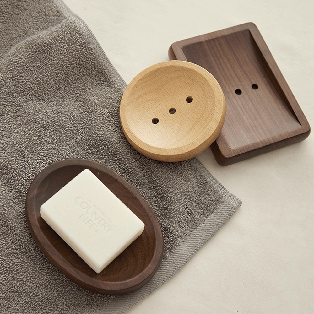 Log style soap boxes made of walnut and beech, ideal for enhancing bathroom decor and practicality.