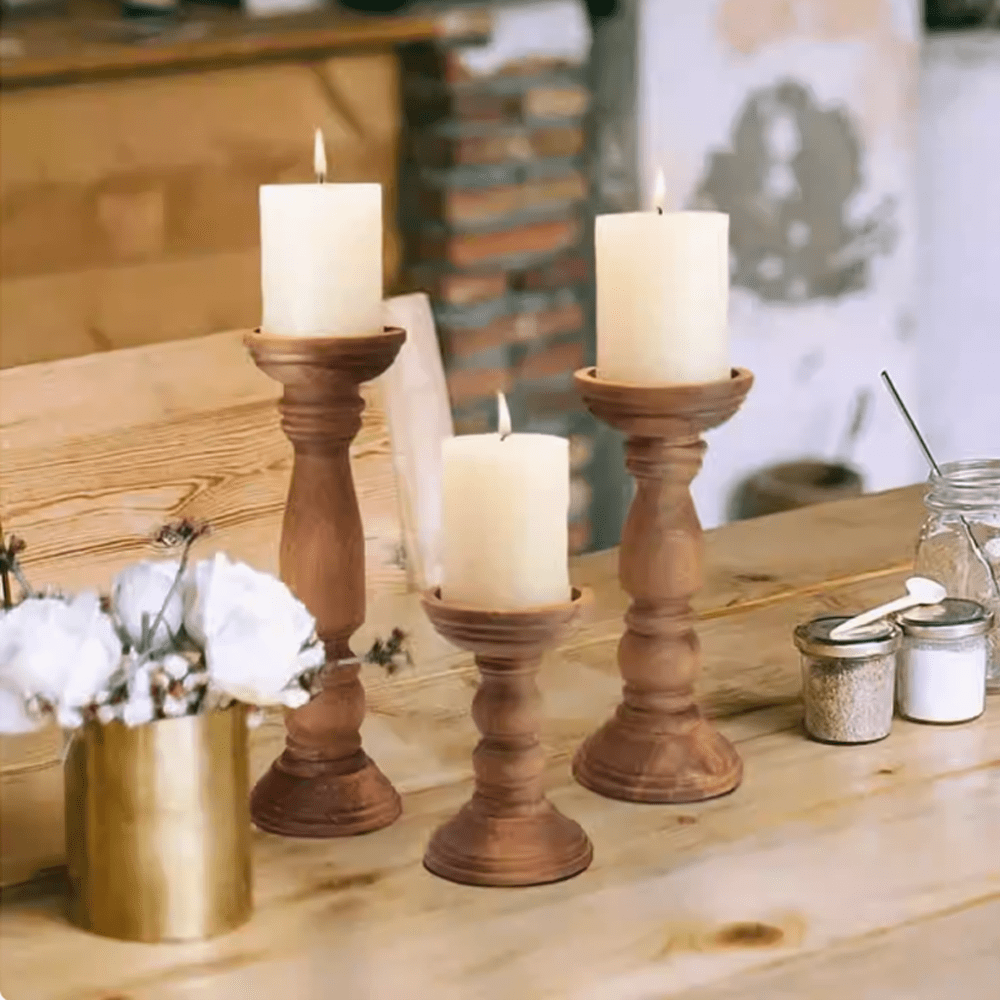 Wabi-sabi style Paulownia wood candle holders with candles on a rustic wooden table, creating a warm and tranquil atmosphere.