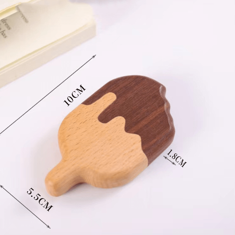 Natural wooden bottle opener shaped like a popsicle with warm tones and smooth textures, ideal for kitchen decor.