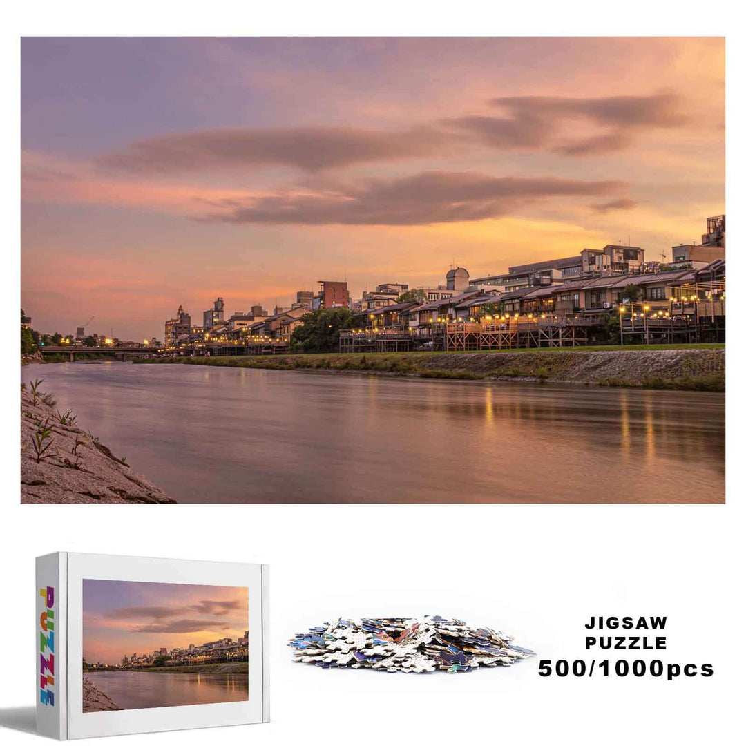Sunset River City 500/1000 piece jigsaw puzzle featuring a serene river view at dusk, enhancing focus and cognitive skills.