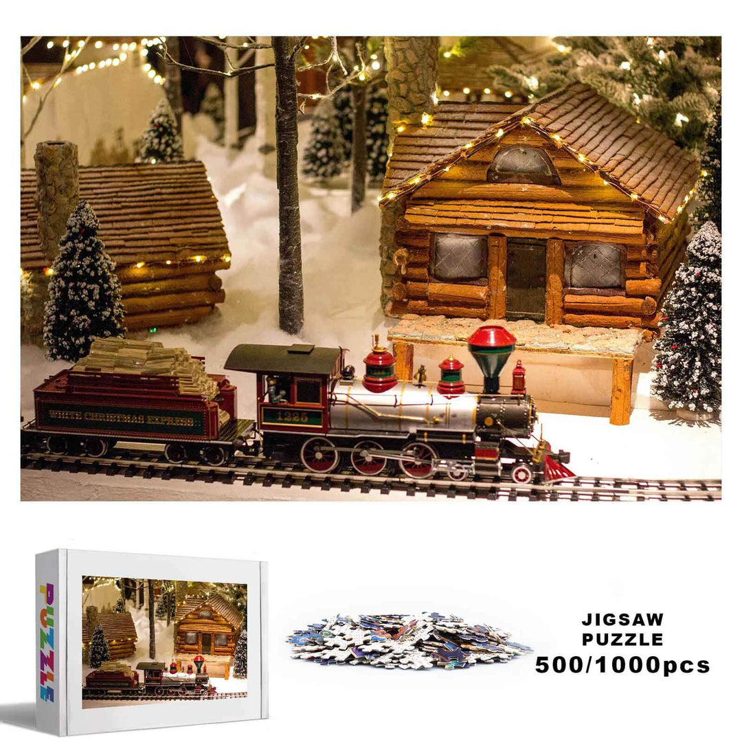 Christmas Train Paradise 500/1000 piece jigsaw puzzle featuring a festive train scene with cozy log cabins and snowy trees.